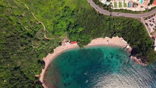 90 Degree Overhead View: Luxury Villas with Pools and Coastal Road on a Montenegrin Bay