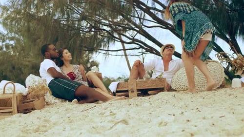 A Beautiful Young Woman Walks Up to Picnic Area to Sit With
