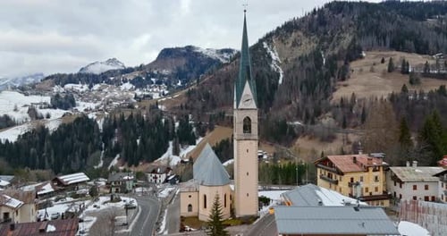 Aerial drone view of the San Lorenzo Church in the Selva di Cadore comune, in the Dolomites, Italy