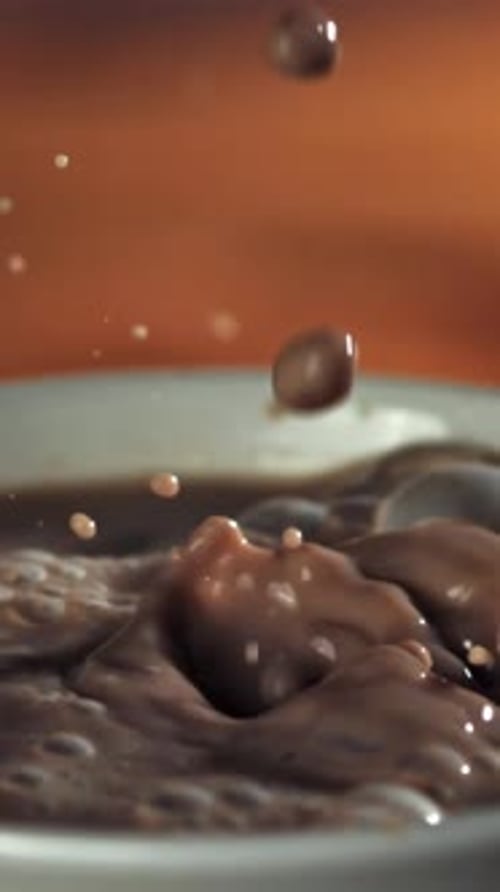 A Drop Falls Into the Hot Chocolate Filmed on a Highspeed Camera at 1000 Fps