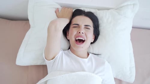 Young beauty woman having orgasm in bed excited female