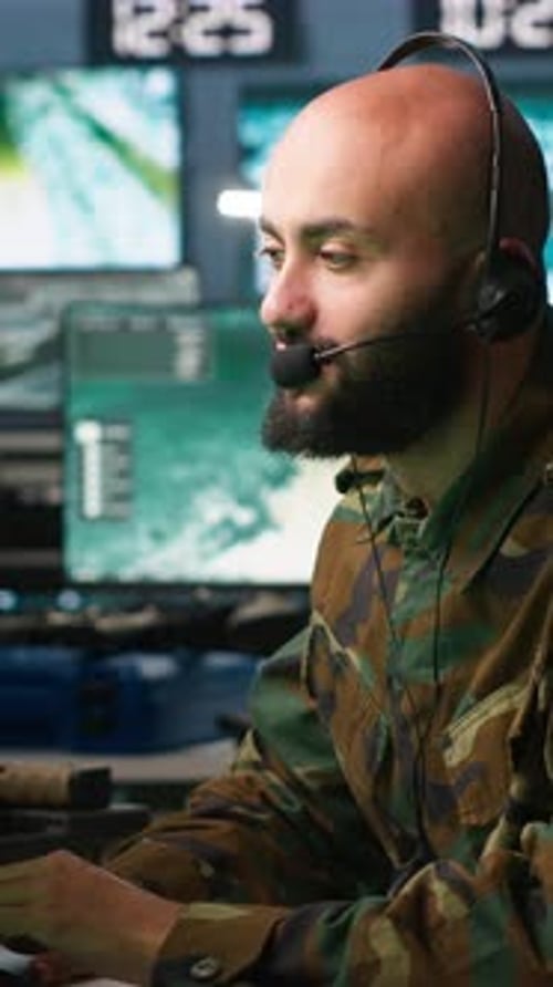 Vertical Video Soldier Solving Tasks in Military HQ Base Gathering Information on Enemy Troops