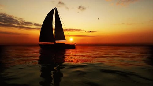 Sailboat Sailing into Golden Sunset Over the Ocean