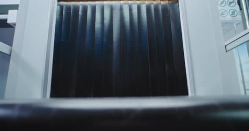 Security Checkpoint in Airport Passenger Takes Suitcase From Conveyor Belt After Luggage Screening