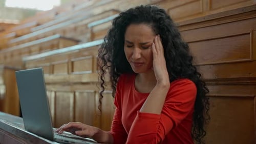 Latina Student Woman Suffering Headache Typing on Laptop in University Classroom Hispanic Girl
