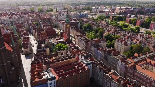 Cinematic morning drone approach toward Gdansk Main Town Hall tower
