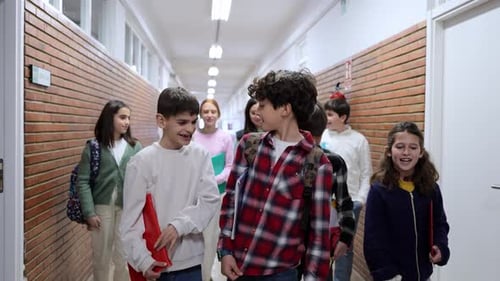 Students Walking and Talking in School Hallway