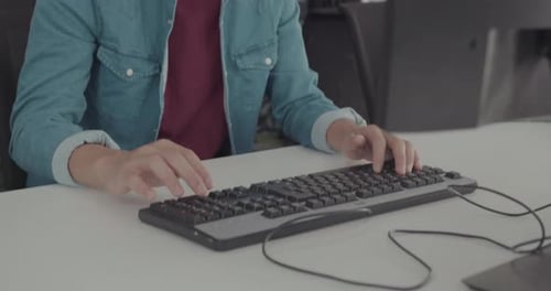 Male Education Student Learning Computer Technology in Classroom