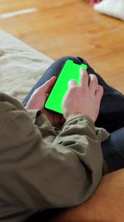 Man Using Smartphone With Green Screen