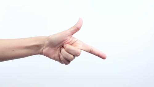 Close up on woman's hand index finger raised while pointing sideways