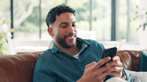 Happy, man and communication with smartphone, lounge and texting with contact, app and social media