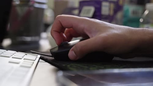 Hand Clicking Black Computer Mouse