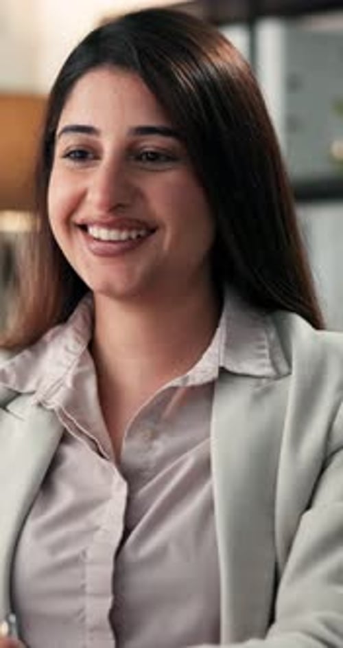 Happy woman, consultant and wave with video call for online advice or business meeting in office