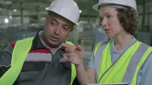 Managers Discussing Delivery at Warehouse
