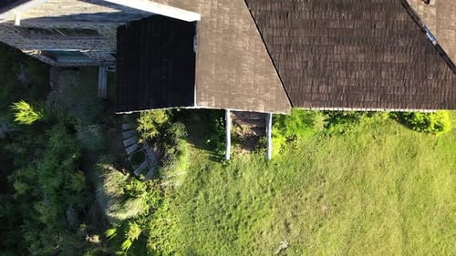 Rustic Stone House Surrounded By Greenery Aerial View