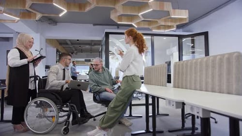 Diverse Colleagues Collaborate in Bright Modern Office