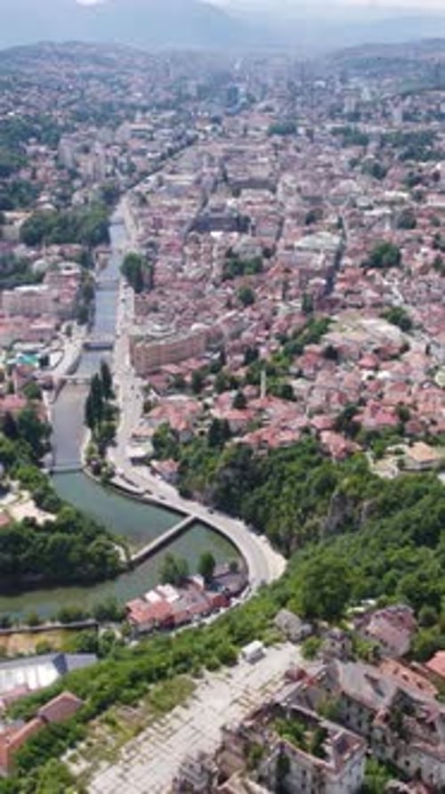 Miljacka River winding through Sarajevo City Center in Bosnia and Herzegovina. Aerial Shot