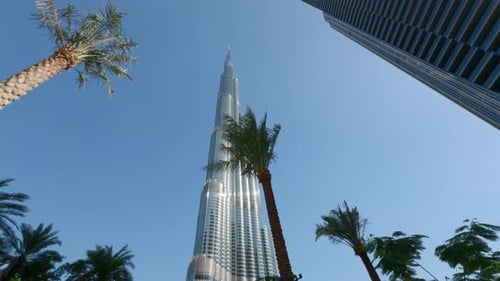 Burj Khalifa in the city of Dubai, United Arab Emirates. Action. Low angle view of a giant skyscrape