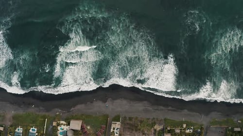 Top Down View Of Foamy Ocean Waves Splashing Sandy Shore In El Paredon, Guatemala - drone shot