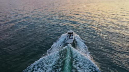 Aerial view to a luxury motor yacht floating in sea