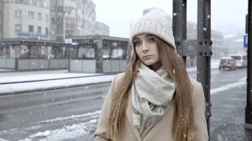 Young Beautiful Pensive Girl Standing in the City, Winter Time 20s