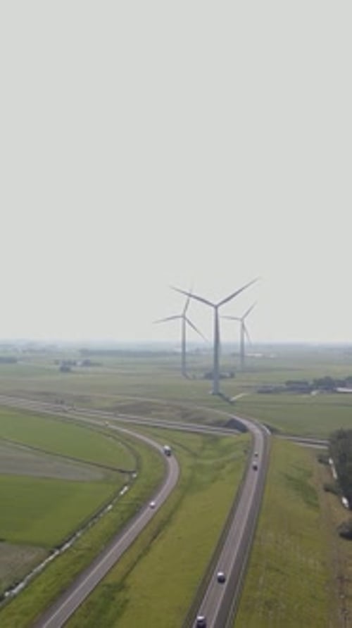 Wind Turbines above Highway Landscape Portrait Orientation