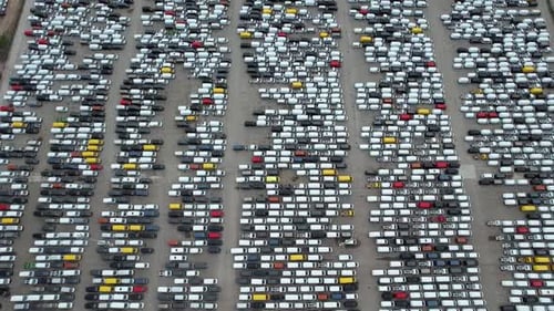 Massive Parking Lot Filled with Vans Aerial View