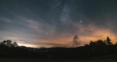 Starry Night Sky with Milky Way Galaxy Stars and Clouds over Countryside