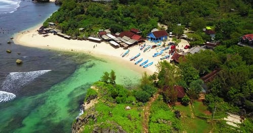 Drone view of the Traditional fisherman village in Indonesia. fishing boats parked on the beach th