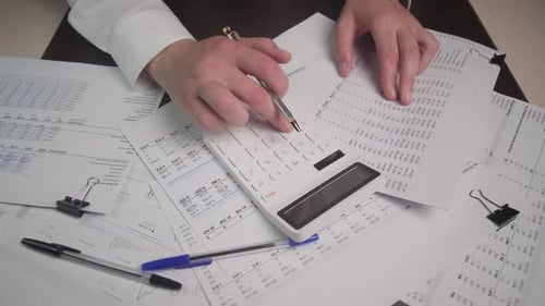Conducting Financial Calculations Using Both Papers and a Calculator for Accuracy and Efficiency