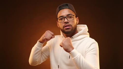 Serious Young Man in White Hoodie Poses