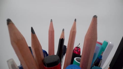Colored pencil with pen holder close up 4K