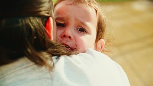 A Tender Moment Between a Caregiver and a Child Showcasing Love Trust and Connection As They Share a