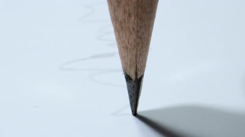 Pencil Tip Drawing Lines on White Paper