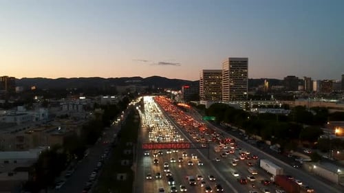 Pan over traffic hour on 405 freeway at dusk