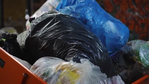 Pile of Garbage Bags in Container