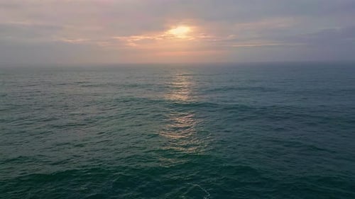 Cloudy Evening Sky Ocean Water Rippling Waving in Slow Motion Marine Horizon