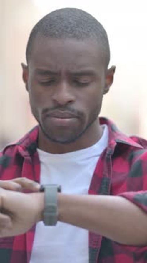 Young Man Uses Smart Watch, Technology Concept