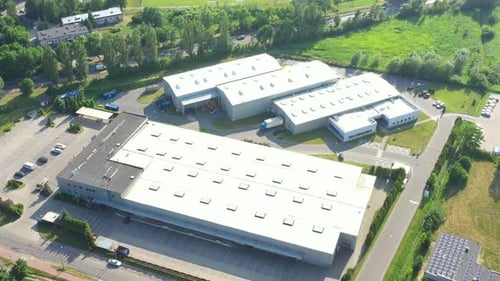 Aerial view of goods warehouse. Logistics center in industrial city zone from above. Aerial view of