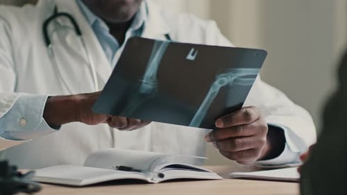 Doctor Examining X-Ray Image in Office Setting