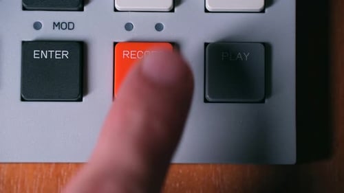 Finger Presses Record, Then Play, Button on Device