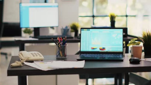 Trading Index Listings Displayed on Notebook Screen in Office Panning Shot