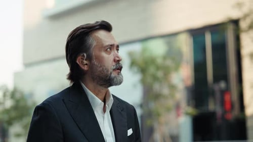 Portrait of Senior Man Entrepreneur in Formal Suit Walks on Street Slow Motion