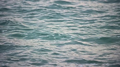 Slow Motion of Disturbed Blue Sea Water Surface