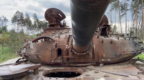 Detail of iron on a rusty armored car of the occupants. Part of a burnt tank