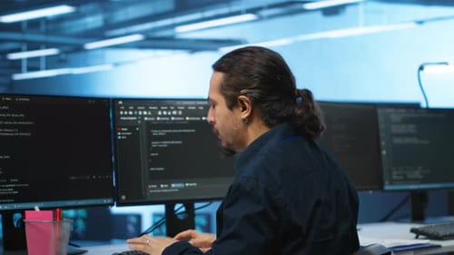 Man Typing at Computer at Modern Office