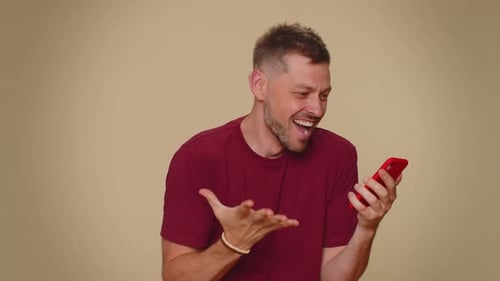 Man Wins Big on Smartphone, Celebrates with Joy