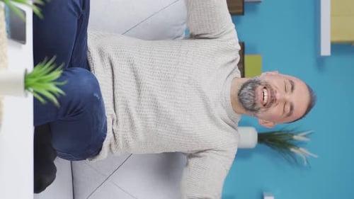 Vertical Video of Fun dancing man at home.