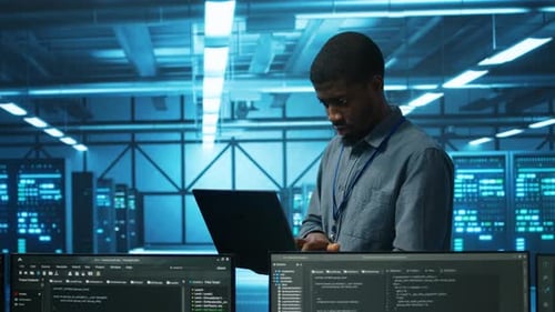 Manager in Server Hub Using Laptop to Find Errors Affecting Performance