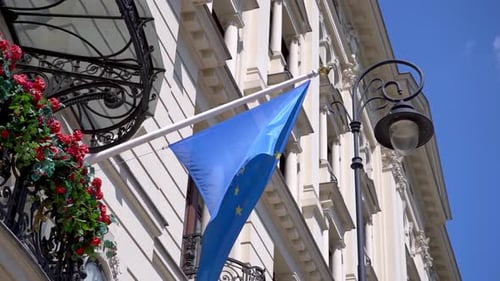 European Union Flag Waving on Building Facade